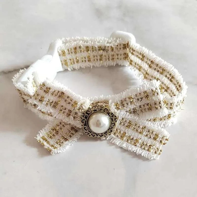 silent cat bow tie collar in elegant white with gold accents and pearl detail