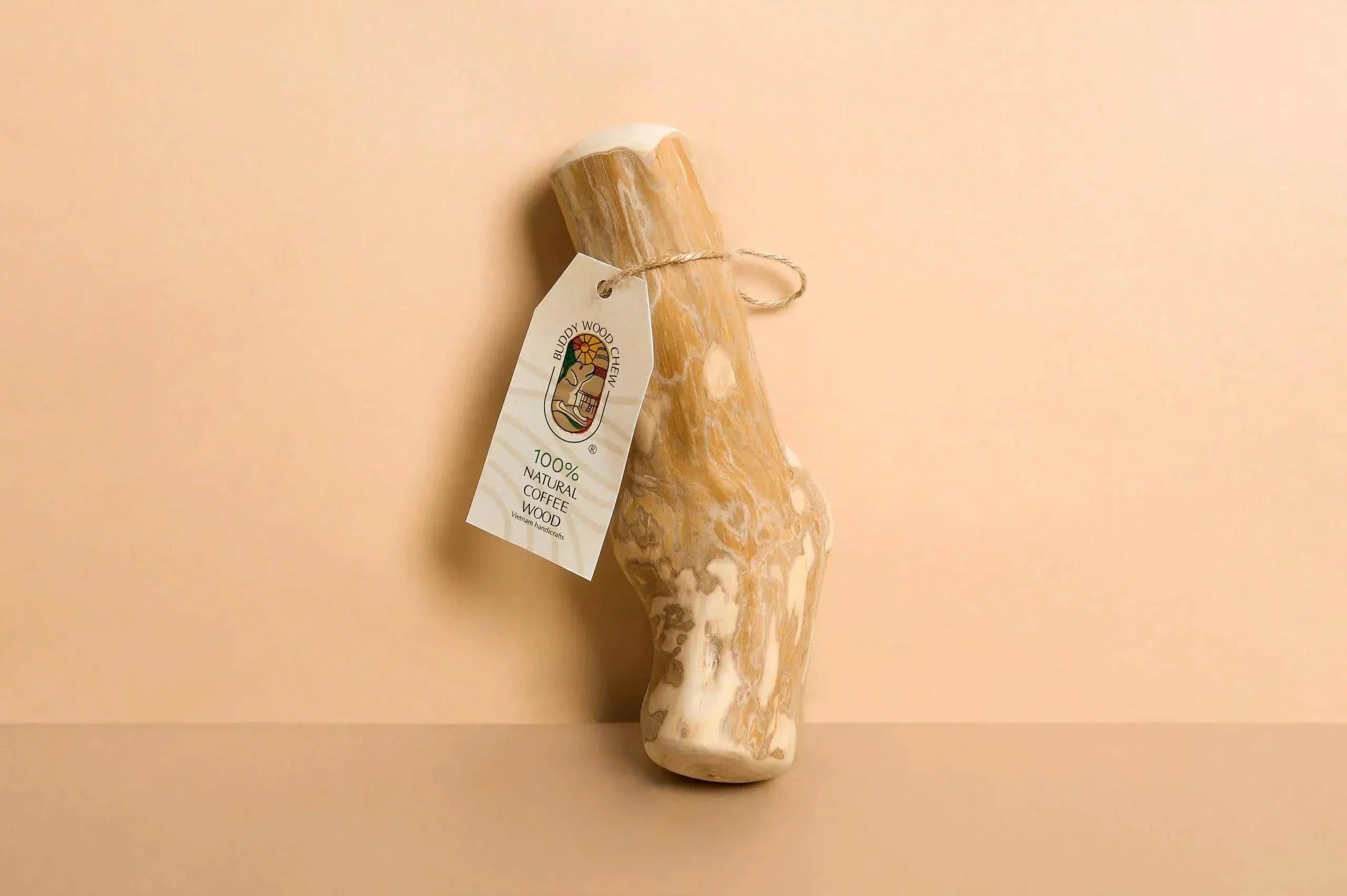 natural dog chew toys made from 100% natural materials with a tag attached, perfect for safe chewing.